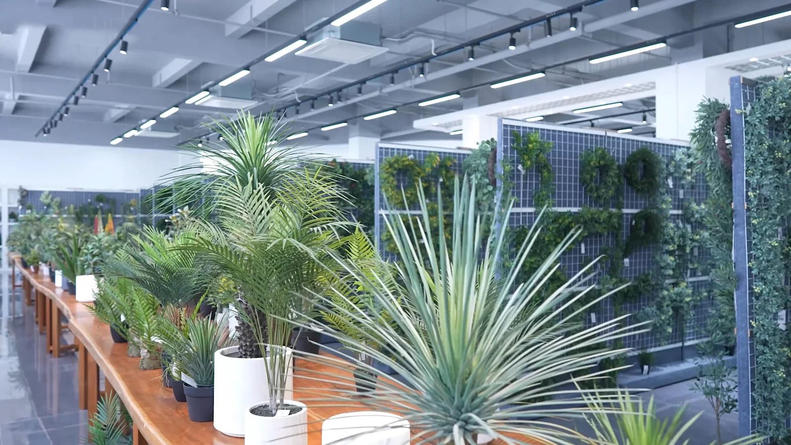 Artificial trees and potted greenery arranged in the showroom featured on Silvanest’s main website